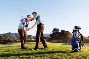 Golfer practicing and concentrating before and after shot during a sunny day