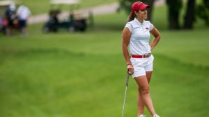 Image of a professional woman golfer with golf club.