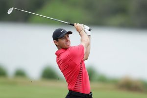 A snapshot of male golfer taking a shot.