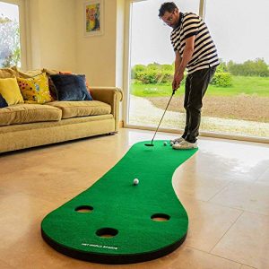 Image showing a man practicing golf from his home.